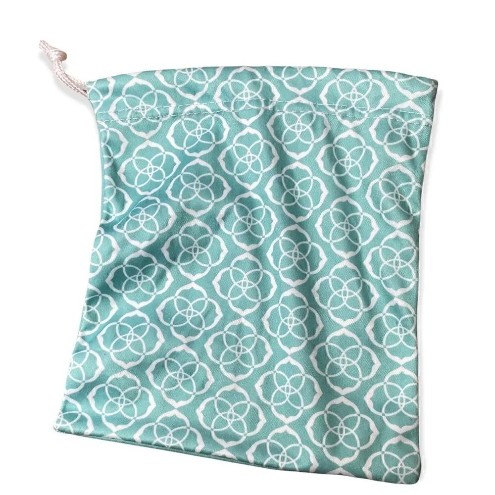 Kendra Scott jewelry bag in turquoise with white signature pattern drawstring
